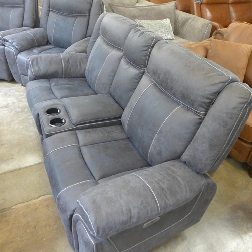 1559 - A Burnley charcoal faux leather and white stitching two seater power reclining sofa with centre cons... 