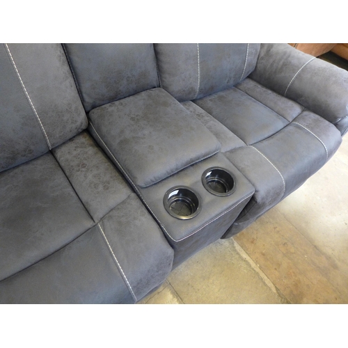 1559 - A Burnley charcoal faux leather and white stitching two seater power reclining sofa with centre cons... 