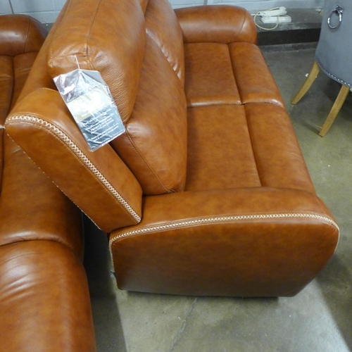 1572 - A Raffa chestnut leather effect and brown stitching three seater and two seater sofa