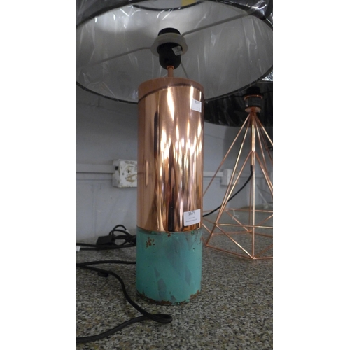 1579 - A copper effect geometric lamp and a copper effect cylinder lamp both with black shades