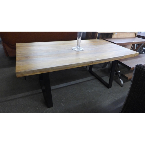 1566 - A hardwood and black metal dining table