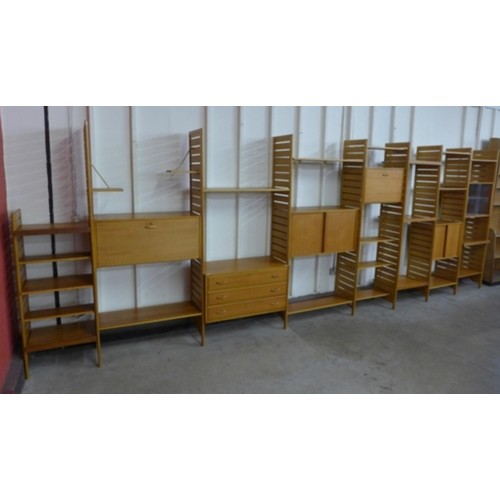 61 - A Staples teak eight bay Ladderax modular room divider