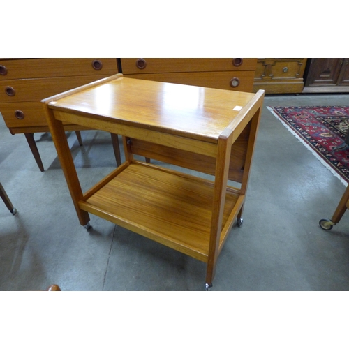 84 - A teak fold over trolley