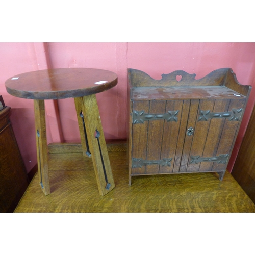 101 - An Arts and Crafts oak smokers cabinet and an Arts and Crafts oak occasional table