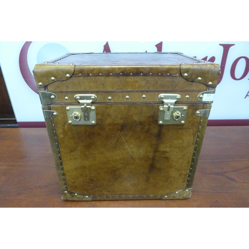 115 - A brown leather and brass mounted trunk