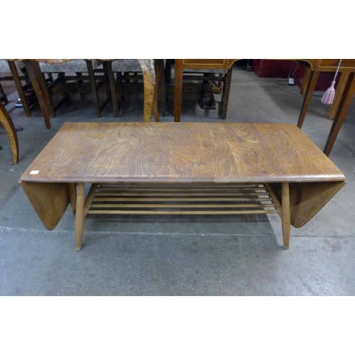 78a - An Erol Blonde elm and beech extending Windsor coffee table