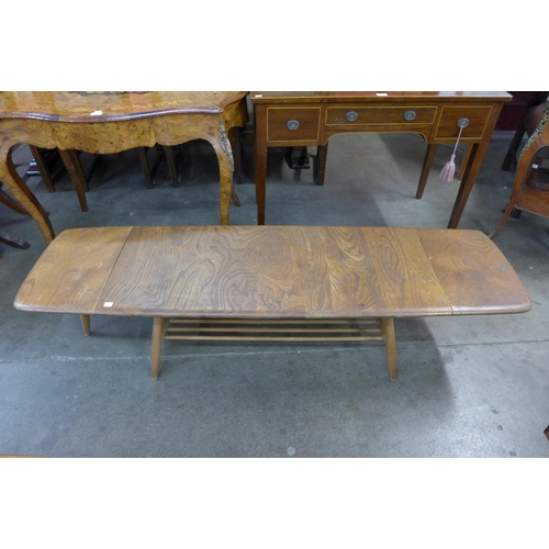 78a - An Erol Blonde elm and beech extending Windsor coffee table