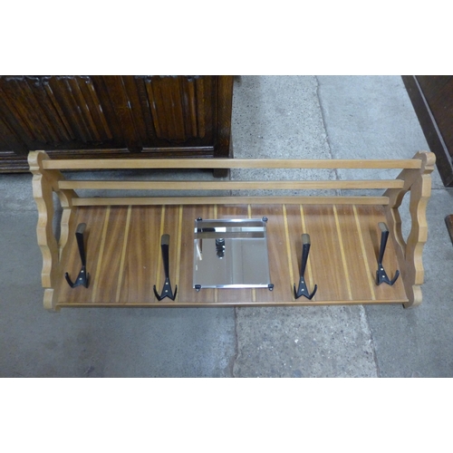 79 - A teak sewing box and a beech wall hanging coat rack