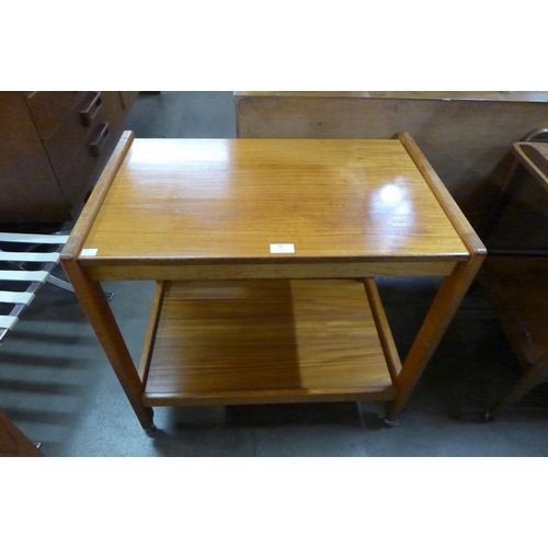 84 - A teak fold over trolley