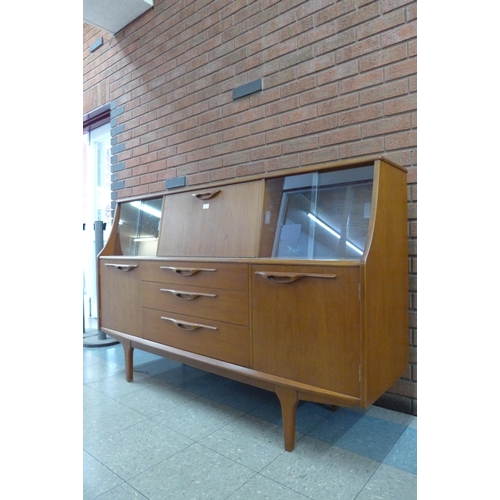 90 - A Jentique teak highboard