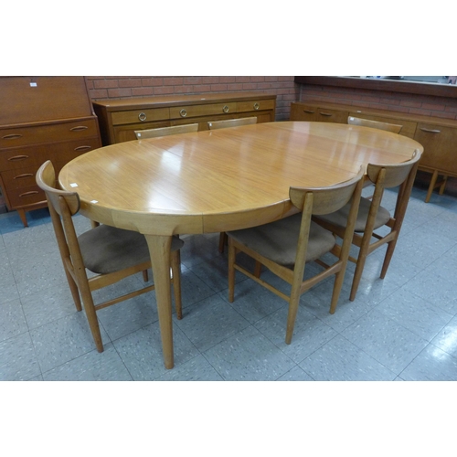 92 - A Danish Faarup Mobelfabrik teak extending dining table, designed by Ib Kofod Larsen and six chairs