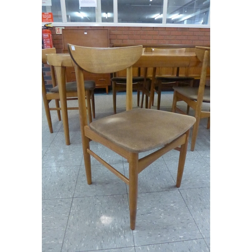 92 - A Danish Faarup Mobelfabrik teak extending dining table, designed by Ib Kofod Larsen and six chairs