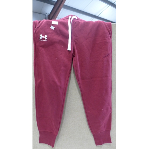 3095 - Two pairs of Women's Burgundy Under Armour tracksuit bottoms, 1 size L & 1 size XL * this lot is sub... 