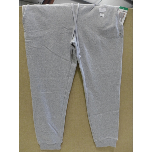 3096 - Two pairs of Women's Grey DKNY Sport tracksuit bottoms, 1 size L and 1 size XL * this lot is subject... 