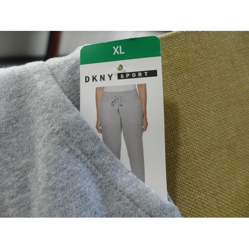 3096 - Two pairs of Women's Grey DKNY Sport tracksuit bottoms, 1 size L and 1 size XL * this lot is subject... 