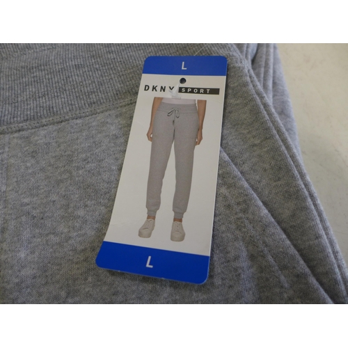 3096 - Two pairs of Women's Grey DKNY Sport tracksuit bottoms, 1 size L and 1 size XL * this lot is subject... 