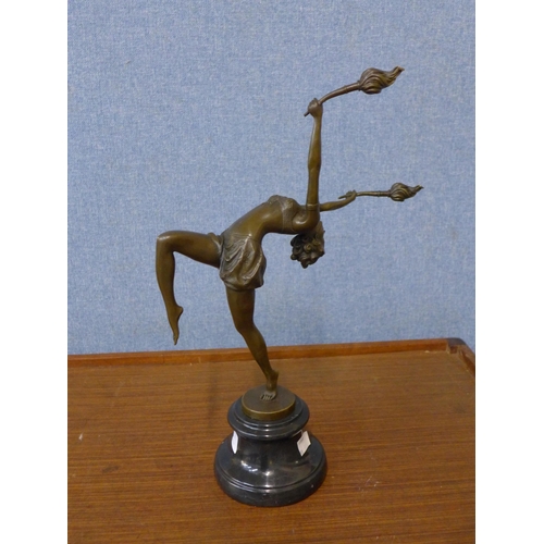 599 - An Art Deco style bronze figure of a female dancer, on black marble socle