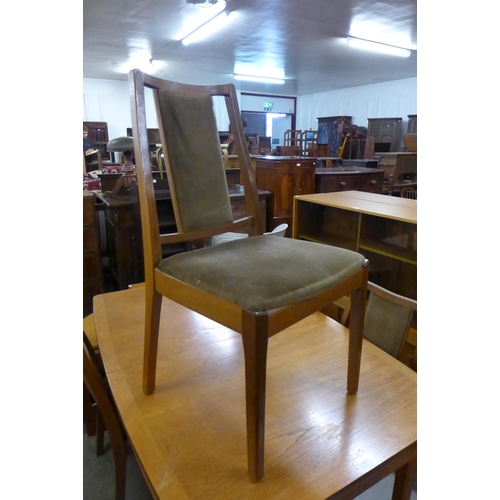 117 - A Nathan teak extending dining table and four chairs