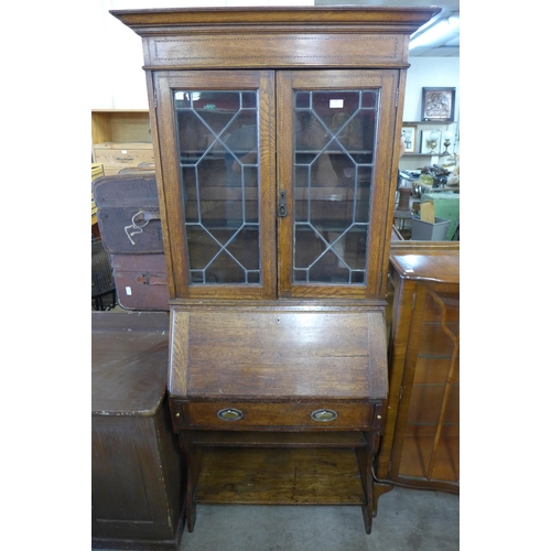 261 - An Edward VII inlaid oak bureau bookcase