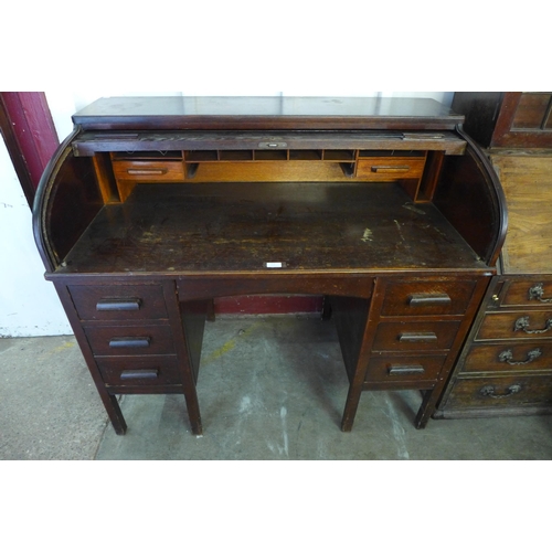 277 - An early 20th Century oak tambour roll top desk