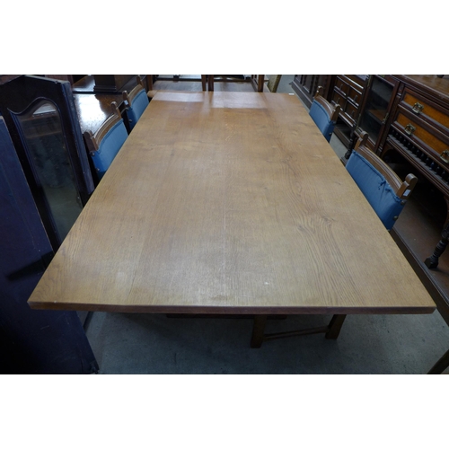 292 - An Arts and Crafts oak refectory table and six chairs, manner of Heals