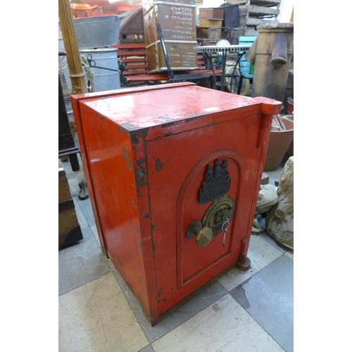 333 - A Victorian painted cast iron safe, with key