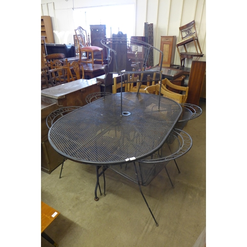 338a - A wrought alloy garden table and five chairs