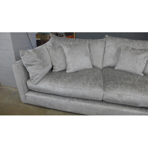 1314 - A grey crushed velvet upholstered three seater sofa