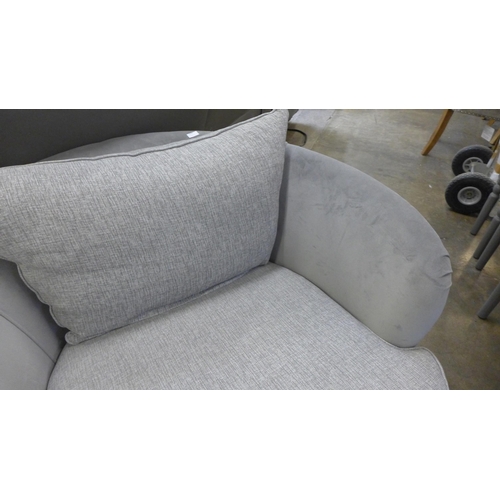 1518 - A grey velvet and textured weave upholstered swivel love seat