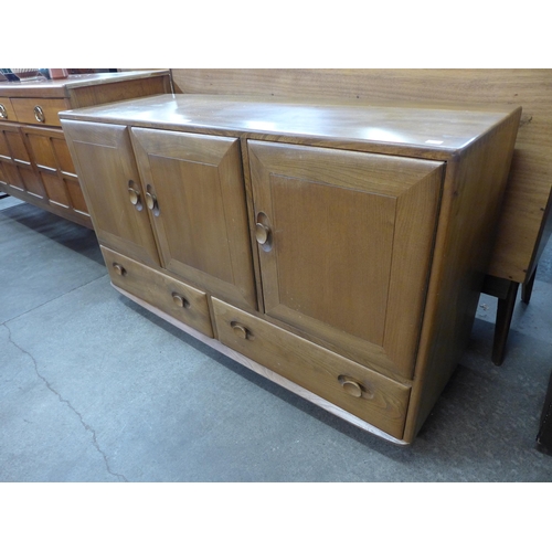 107 - An Ercol Blonde elm and beech sideboard