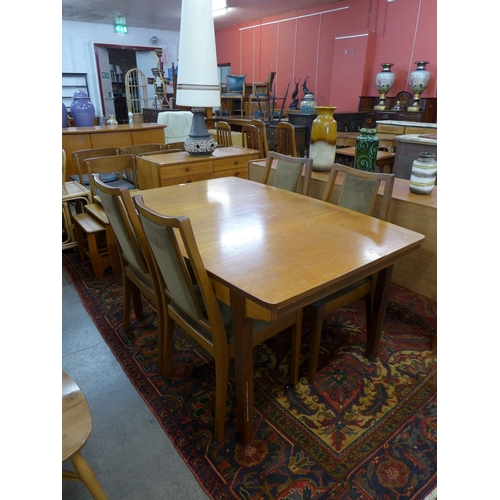 117 - A Nathan teak extending dining table and four chairs