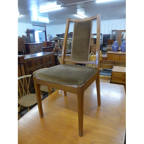 117 - A Nathan teak extending dining table and four chairs