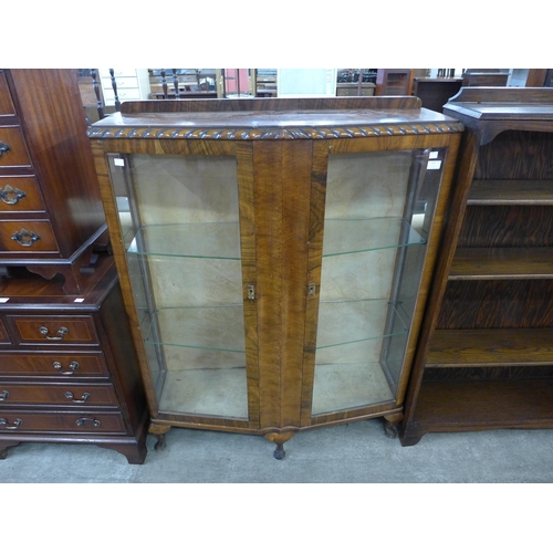 137 - A walnut two door display cabinet