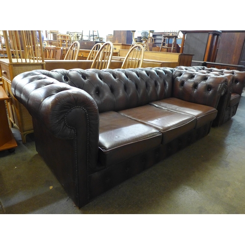 16 - A brown leather Chesterfield  settee