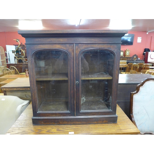 163 - A small Victorian walnut two door bookcase