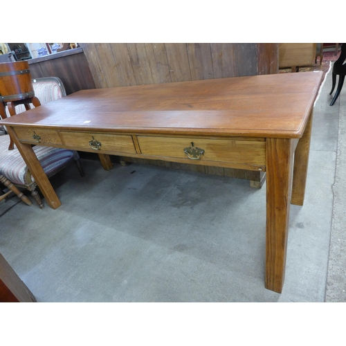 175 - A large early 20th Century oak and beech three drawer library table