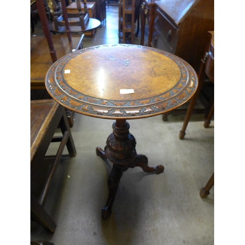 191 - A Victorian walnut and burr walnut circular tripod wine table