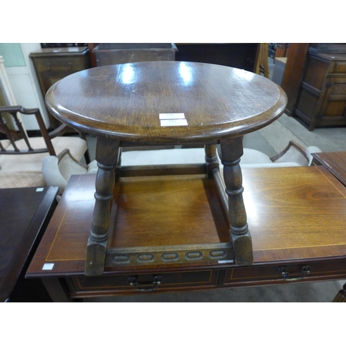 208 - A circular oak occasional table