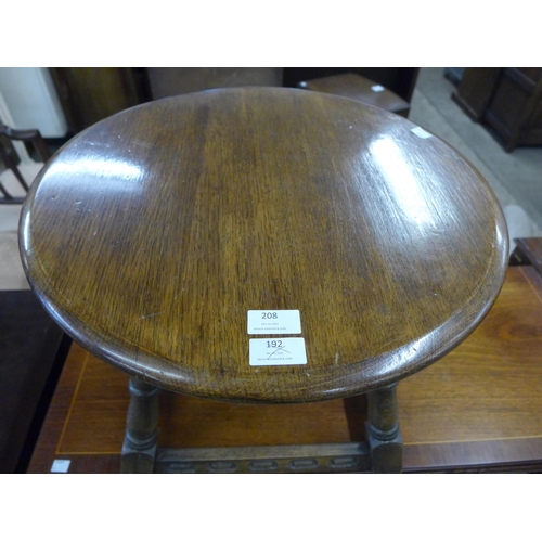 208 - A circular oak occasional table