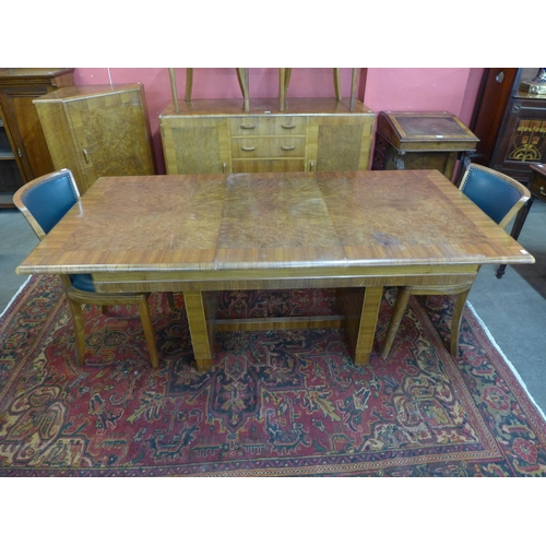 21 - A Heals Art Deco walnut and burr walnut dining suite, comprising; extending dining table, six chairs... 