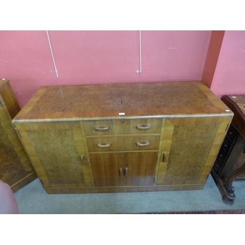 21 - A Heals Art Deco walnut and burr walnut dining suite, comprising; extending dining table, six chairs... 