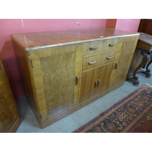 21 - A Heals Art Deco walnut and burr walnut dining suite, comprising; extending dining table, six chairs... 