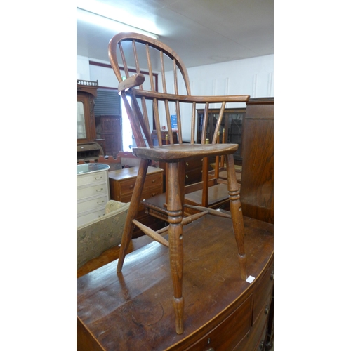 224 - A Victorian elm child's Windsor high chair