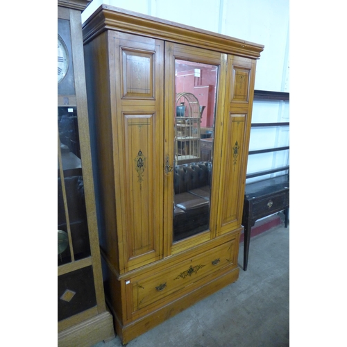 226 - A Victorian Aesthetic Movement painted pine wardrobe