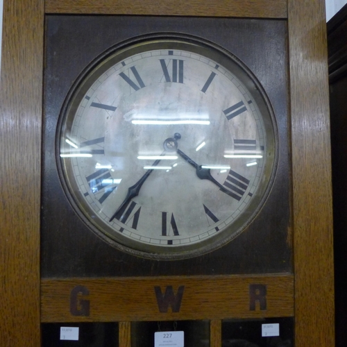 227 - An early 20th Century oak triple weight longcase clock, bearing inlaid G.W.R. letteringn to case