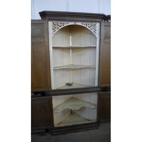 231 - A George III oak freestanding corner cupboard