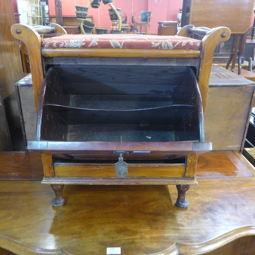 234 - A Victorian mahogany and upholstered piano stool