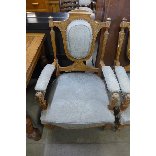 236 - A pair of Edward VII inlaid satinwood armchairs