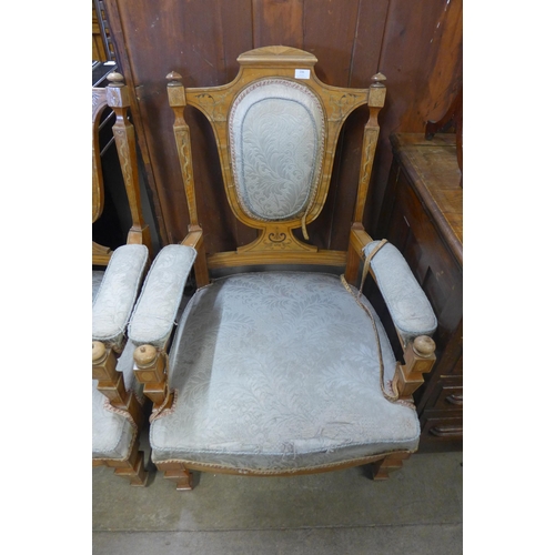 236 - A pair of Edward VII inlaid satinwood armchairs