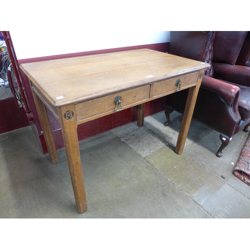 25 - A Victorian Gothic Revival oak two drawer table, manner of A.W.N Pugin